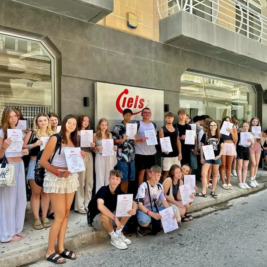 A group of about twenty students in front of IELS Malta