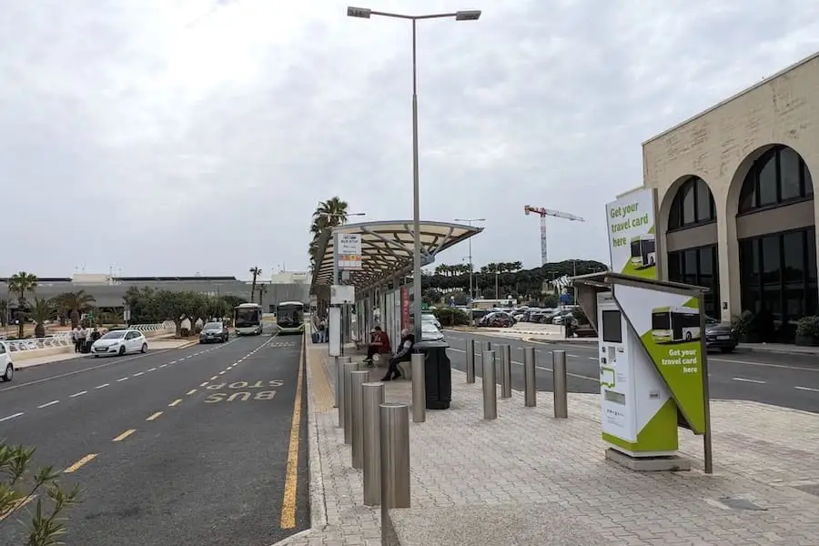 Bus station at Malta Airport with a ticket machine